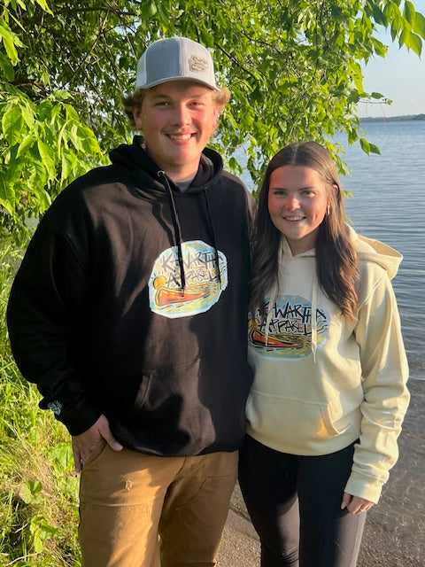 Smiling man and wonam facing camera wearing Founders Edition Hoodies