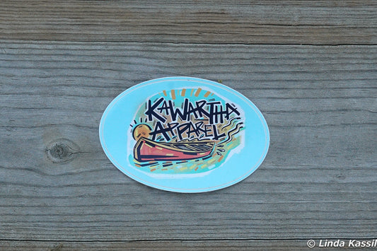 Kawartha Apparel 2" x 3" oval sticker on a dock